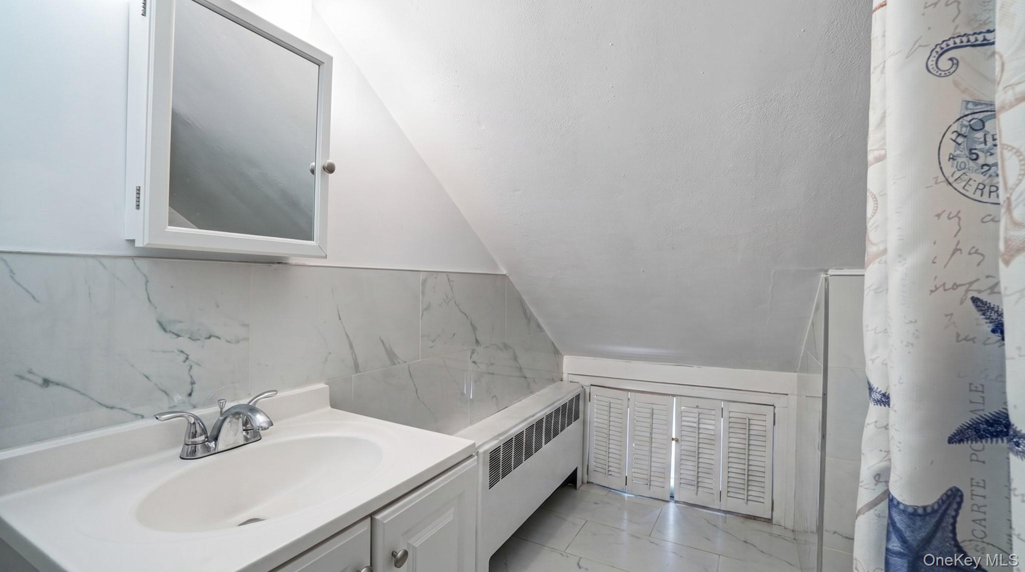 63 Blacksmith Road Levittown, NY 11756 - Photo 18 of 25 Bathroom vanity with integrated sink and chrome faucet