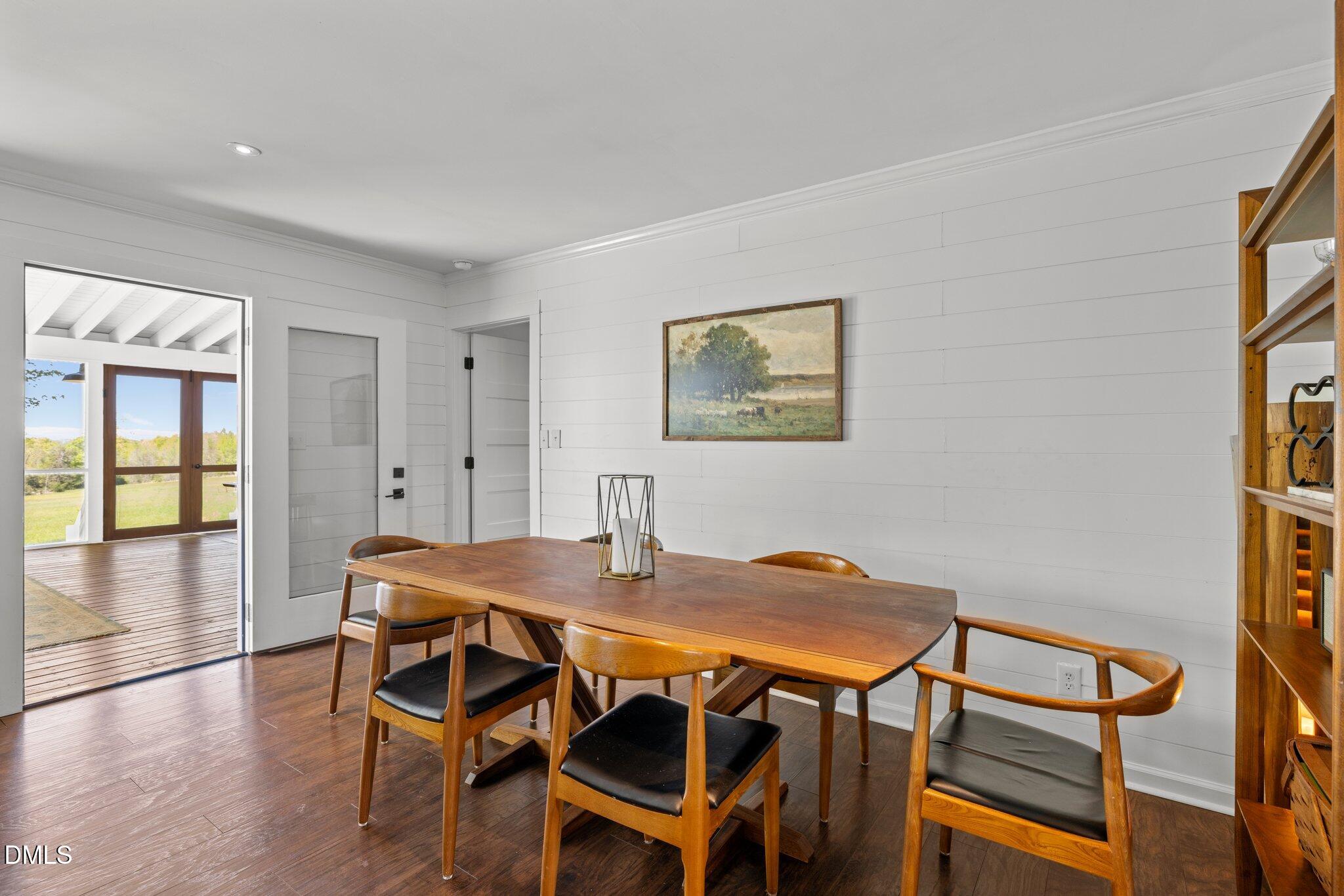 9400 Wheelers Church Road Cedar Grove, NC 27231 - Photo 21 of 96 a view of a dining room with furniture and wooden floor
