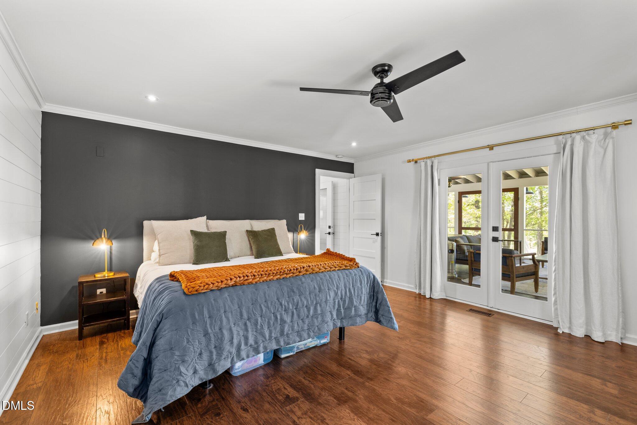 9400 Wheelers Church Road Cedar Grove, NC 27231 - Photo 25 of 96 a bedroom with a bed and a large mirror