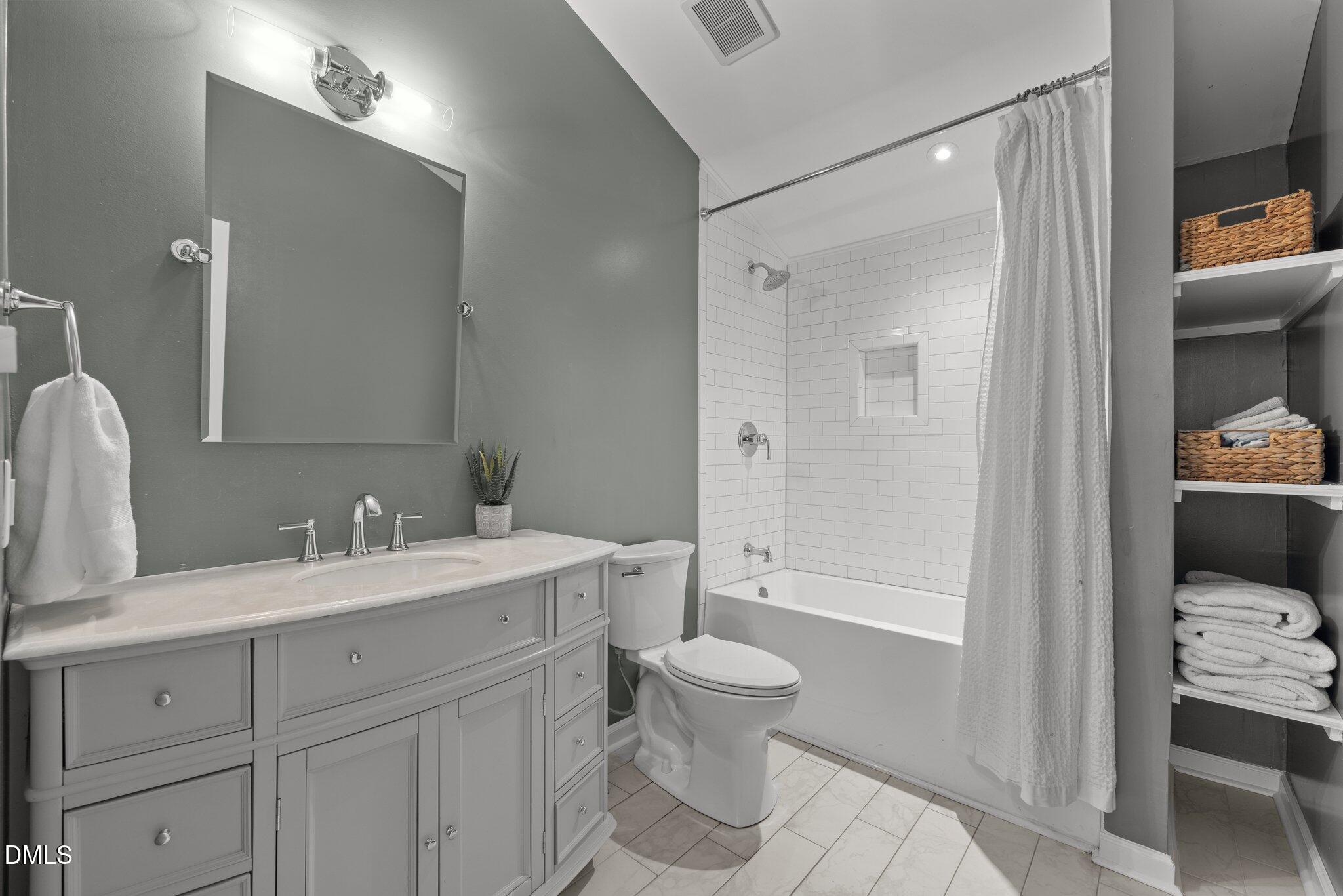 9400 Wheelers Church Road Cedar Grove, NC 27231 - Photo 31 of 96 a bathroom with a sink a toilet and shower
