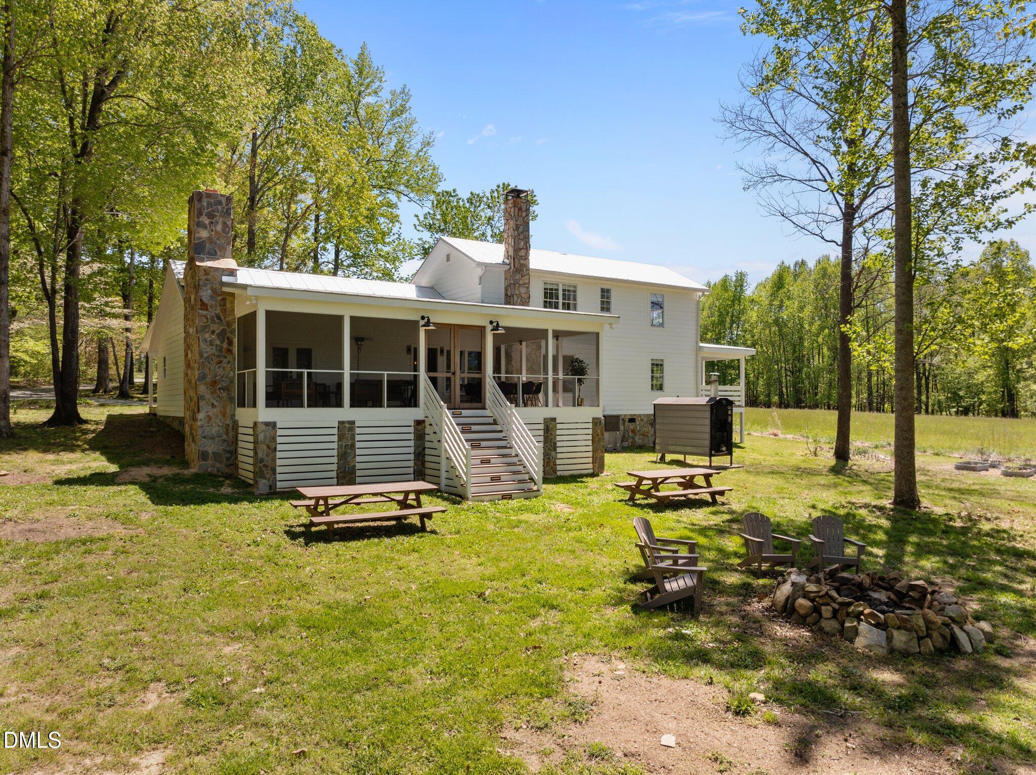 9400 Wheelers Church Road Cedar Grove, NC 27231 - Photo 43 of 96 a view of a house with backyard porch and sitting area
