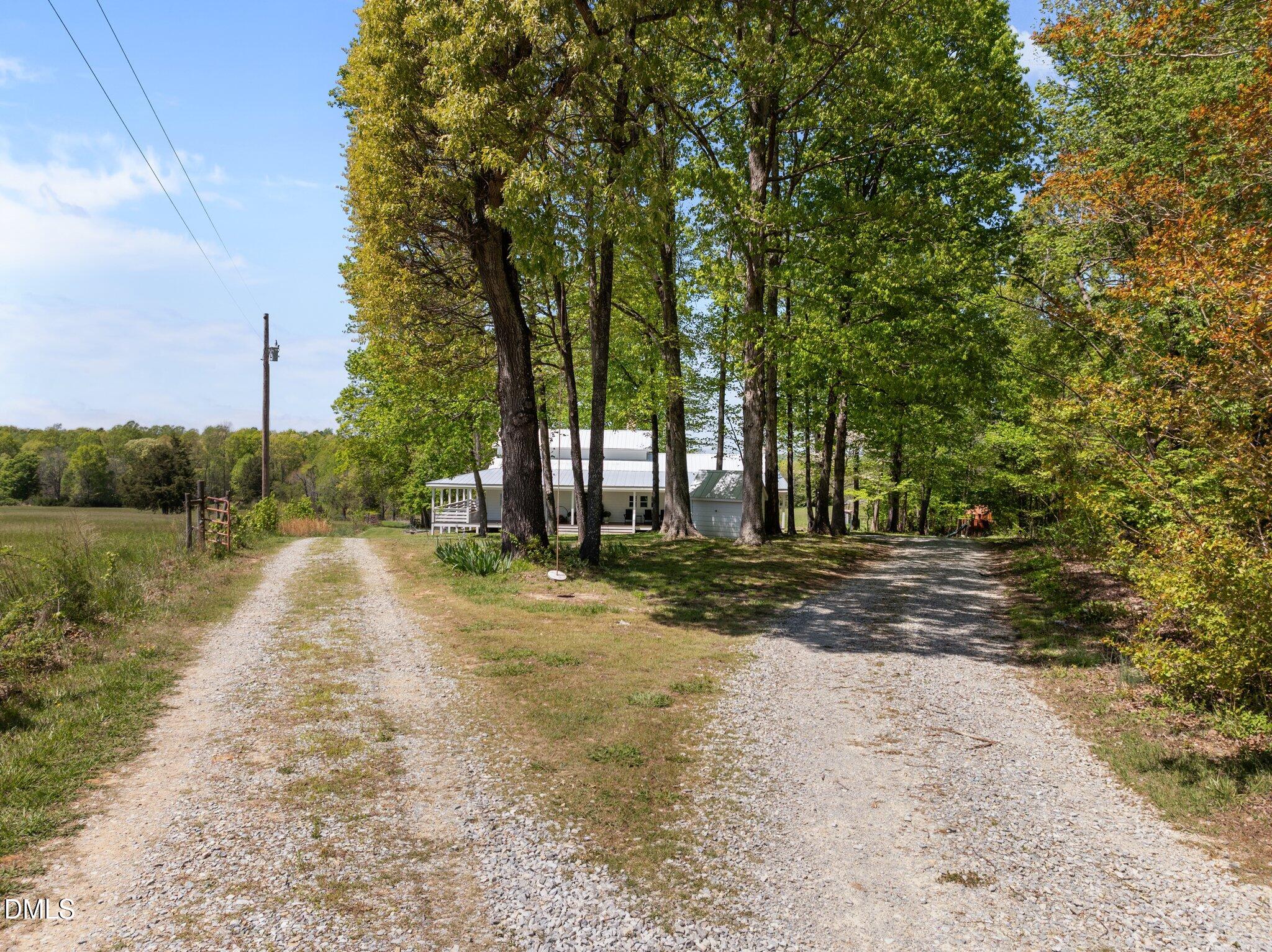 9400 Wheelers Church Road Cedar Grove, NC 27231 - Photo 50 of 96 a view of a yard with plants and trees