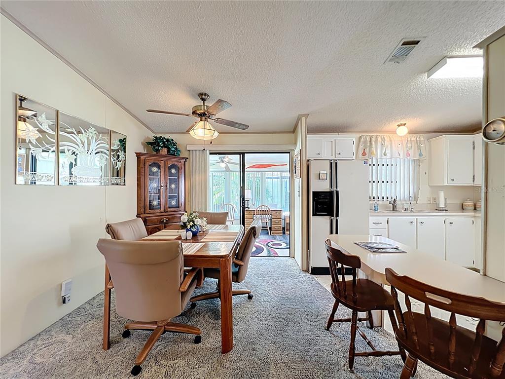 25125 Bellevue Leesburg, FL 34748 - Photo 12 of 44 a view of a dining room with furniture