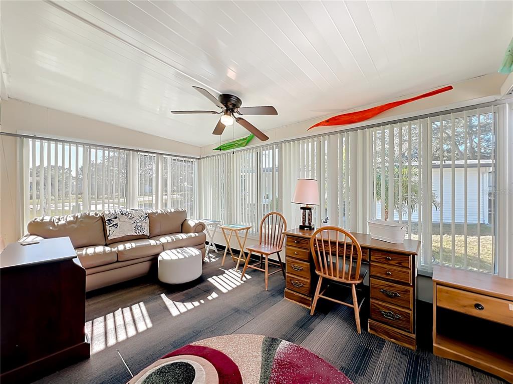 25125 Bellevue Leesburg, FL 34748 - Photo 20 of 44 a living room with furniture and a large window