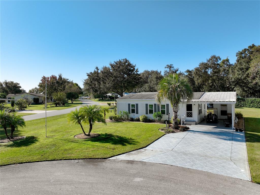 25125 Bellevue Leesburg, FL 34748 - Photo 2 of 44 a view of a house with a yard