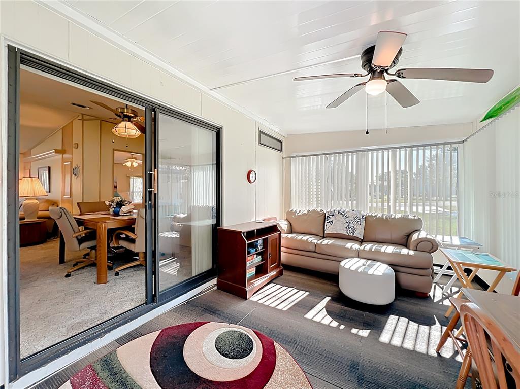 25125 Bellevue Leesburg, FL 34748 - Photo 21 of 44 a living room with furniture and a large window