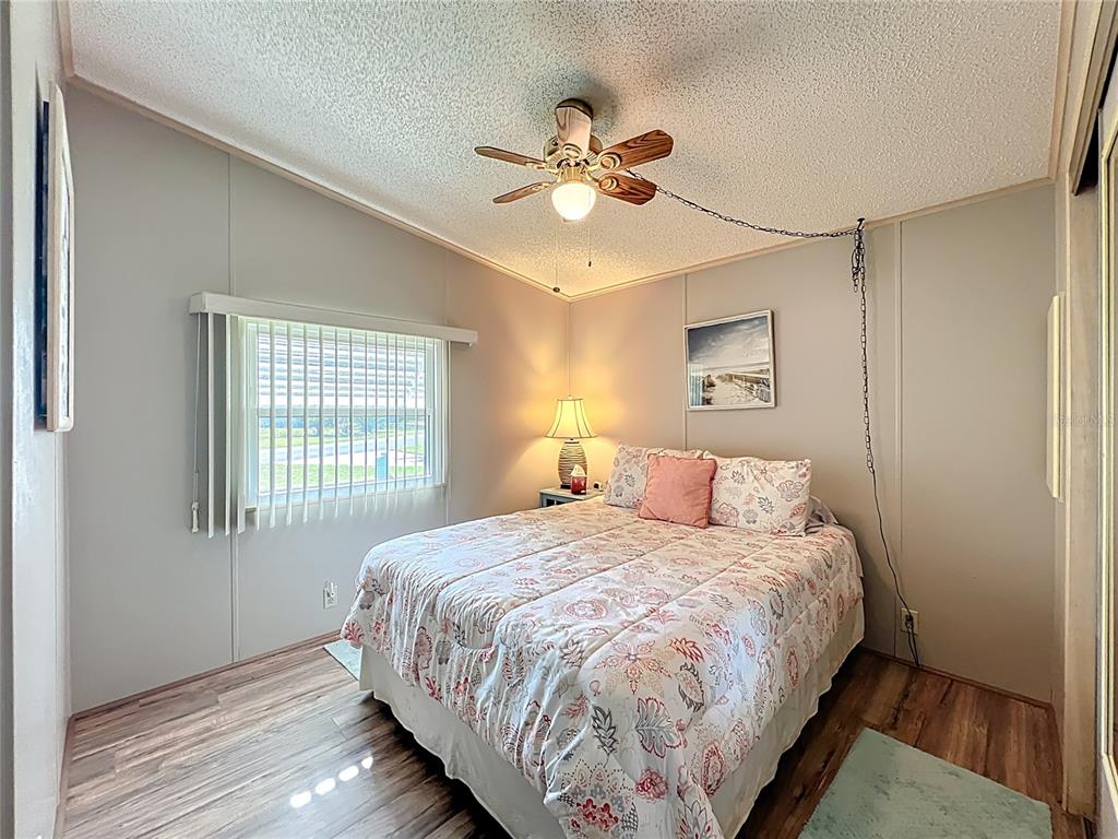 25125 Bellevue Leesburg, FL 34748 - Photo 29 of 44 a bedroom with a bed and window