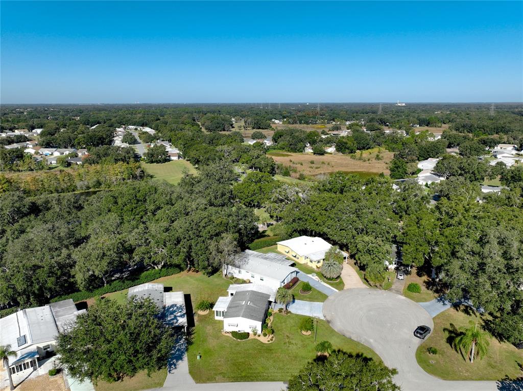 25125 Bellevue Leesburg, FL 34748 - Photo 40 of 44 an aerial view of a house with a yard