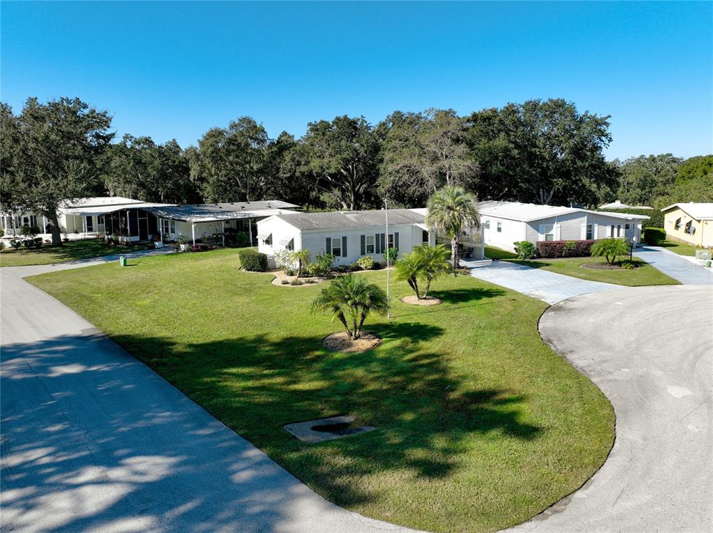 25125 Bellevue Leesburg, FL 34748 - Photo 4 of 44 a swimming pool with trees in the background