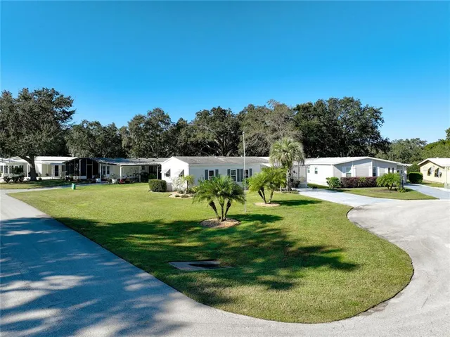 a view of a house with swimming pool