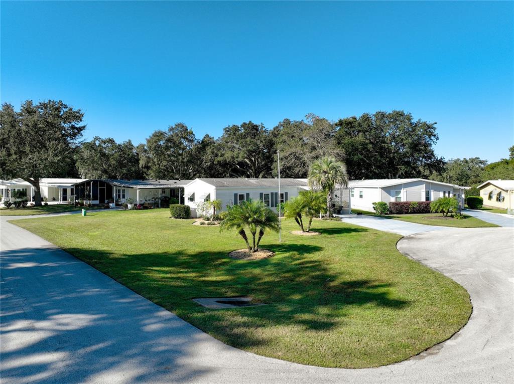 25125 Bellevue Leesburg, FL 34748 - Photo 5 of 44 a view of a house with swimming pool