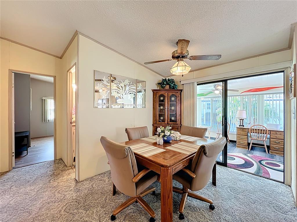 25125 Bellevue Leesburg, FL 34748 - Photo 9 of 44 a view of a dining room with furniture window and outside view
