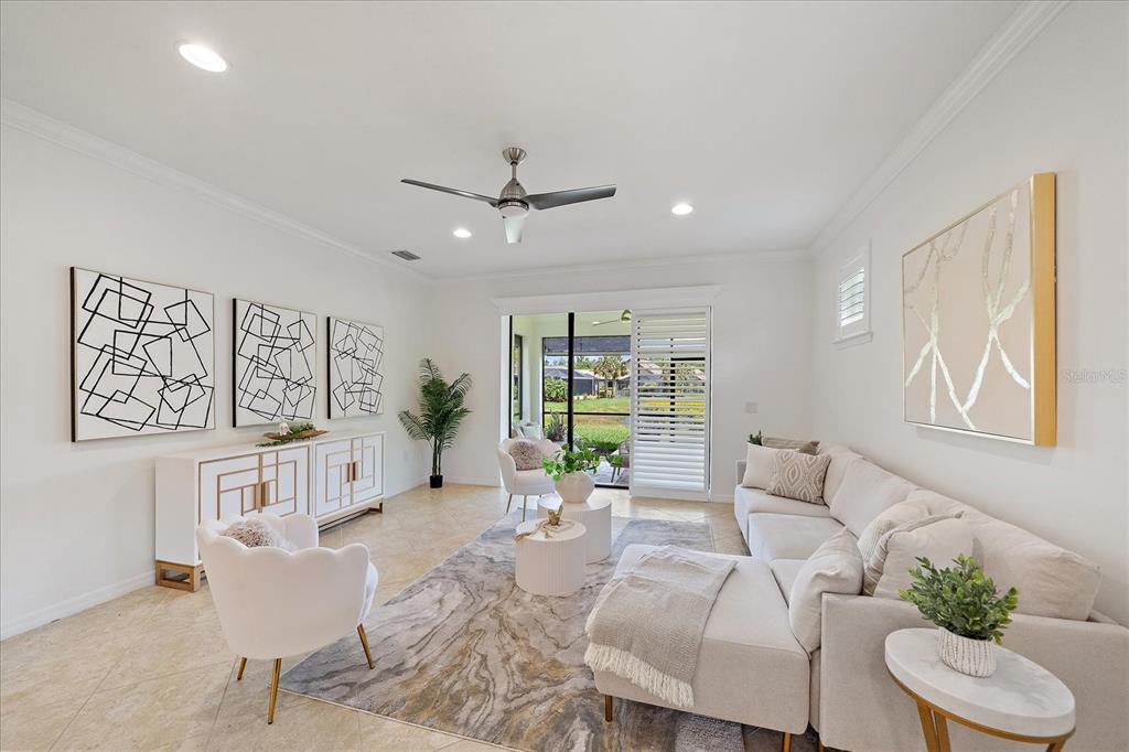 6713 Chester Trail Lakewood Ranch, FL 34202 - Photo 13 of 45 a living room with furniture and a large window