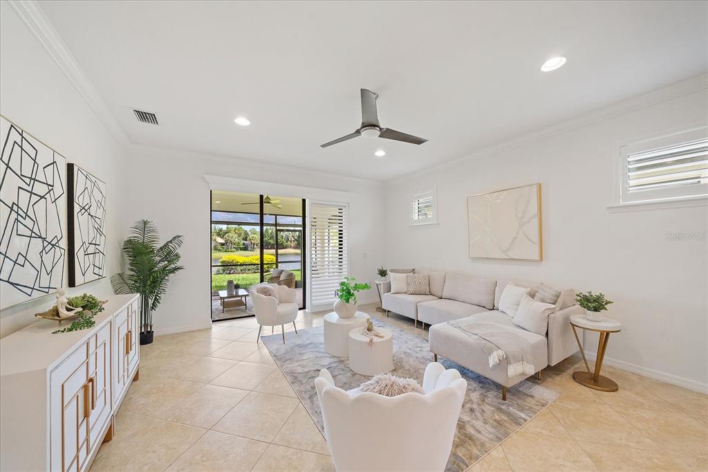 6713 Chester Trail Lakewood Ranch, FL 34202 - Photo 14 of 45 a living room with furniture and a large window