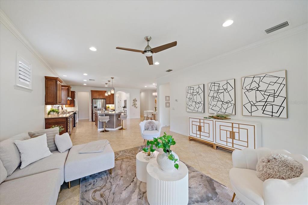 6713 Chester Trail Lakewood Ranch, FL 34202 - Photo 15 of 45 a living room with furniture kitchen view and a large window