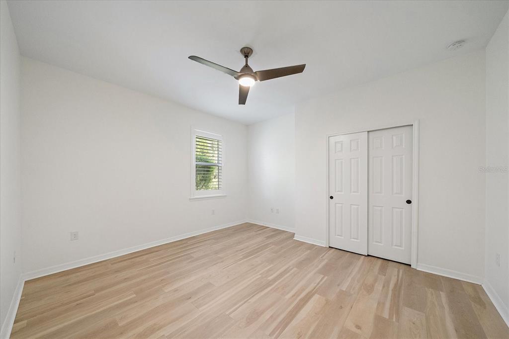 6713 Chester Trail Lakewood Ranch, FL 34202 - Photo 24 of 45 wooden floor in an empty room with a window