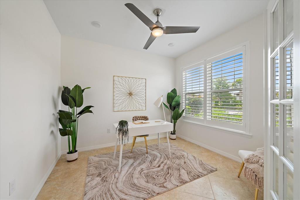 6713 Chester Trail Lakewood Ranch, FL 34202 - Photo 27 of 45 a living room with furniture a window and a potted plant
