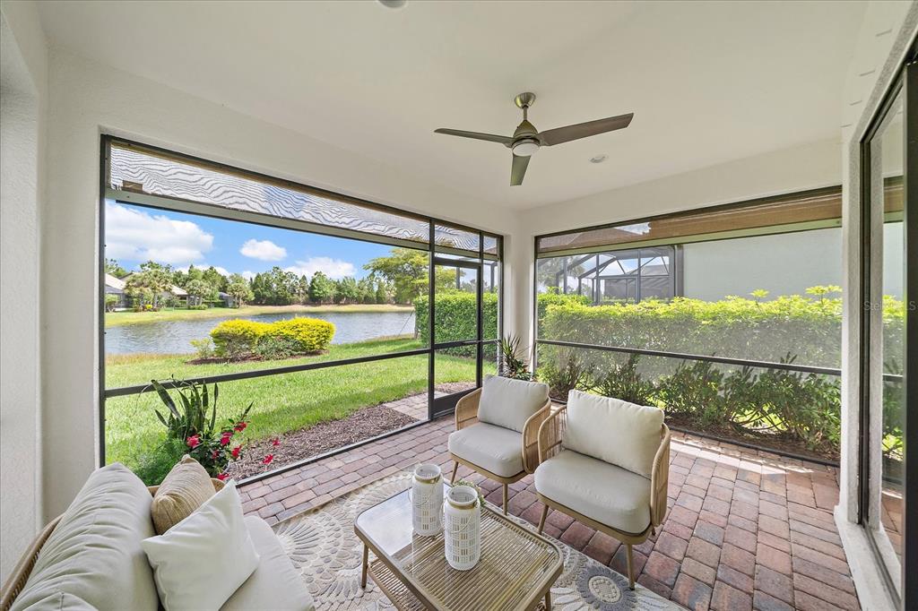 6713 Chester Trail Lakewood Ranch, FL 34202 - Photo 31 of 45 a living room with furniture and a large window