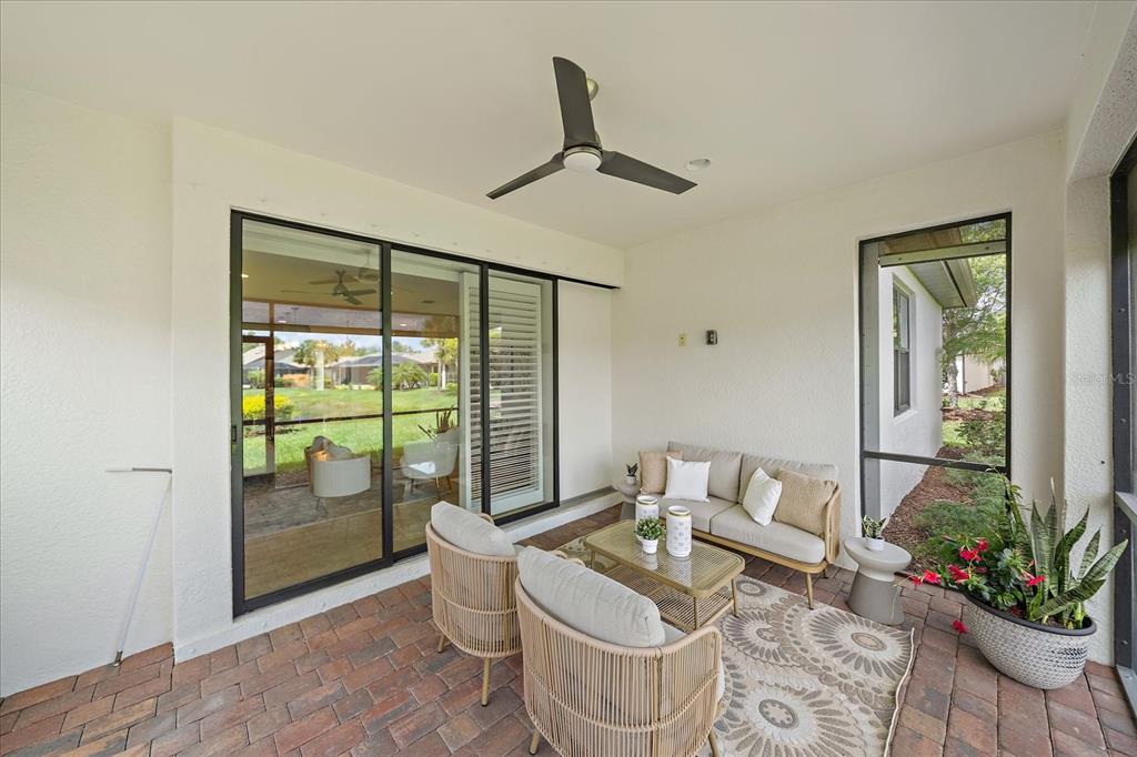 6713 Chester Trail Lakewood Ranch, FL 34202 - Photo 32 of 45 a living room with furniture and a potted plant