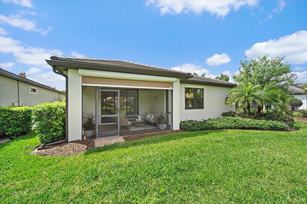 6713 Chester Trail Lakewood Ranch, FL 34202 - Photo 33 of 45 a view of a house with a yard