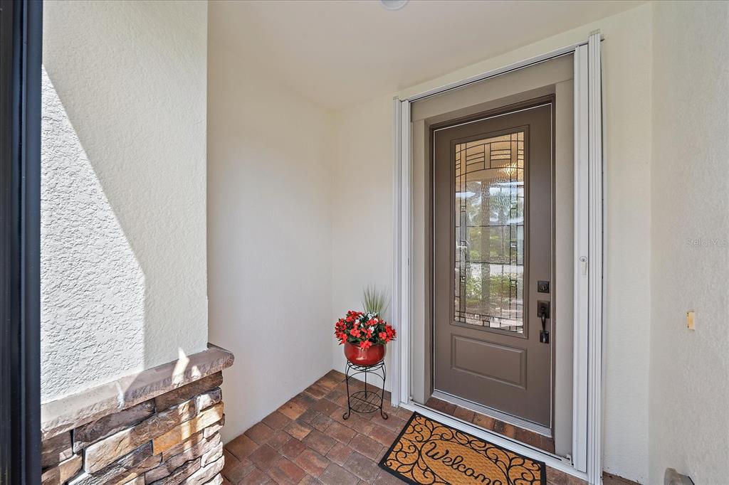 6713 Chester Trail Lakewood Ranch, FL 34202 - Photo 38 of 45 a view of an entryway with wooden floor