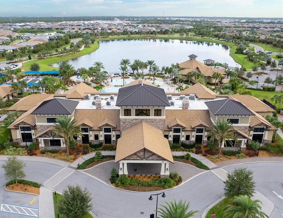 6713 Chester Trail Lakewood Ranch, FL 34202 - Photo 42 of 45 an aerial view of a house with swimming pool and ocean view