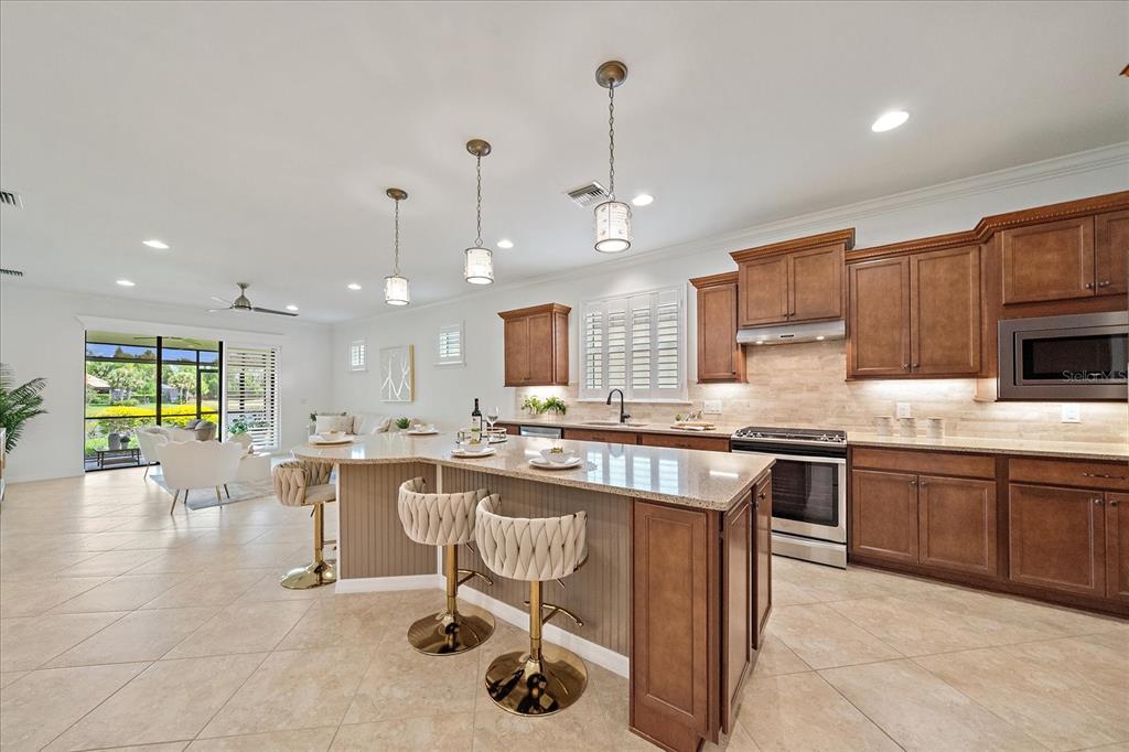 6713 Chester Trail Lakewood Ranch, FL 34202 - Photo 7 of 45 a large kitchen with lots of counter space sink and appliances