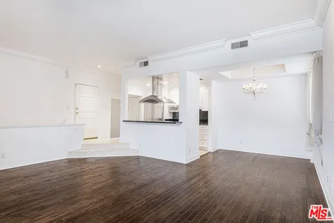 a view of a kitchen with wooden floor