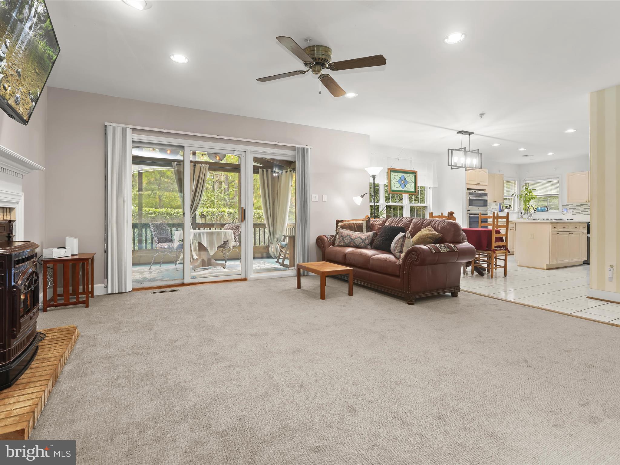 7501 Hillmeade Road Bowie, MD 20720 - Photo 13 of 55 Family room w stove & porch access