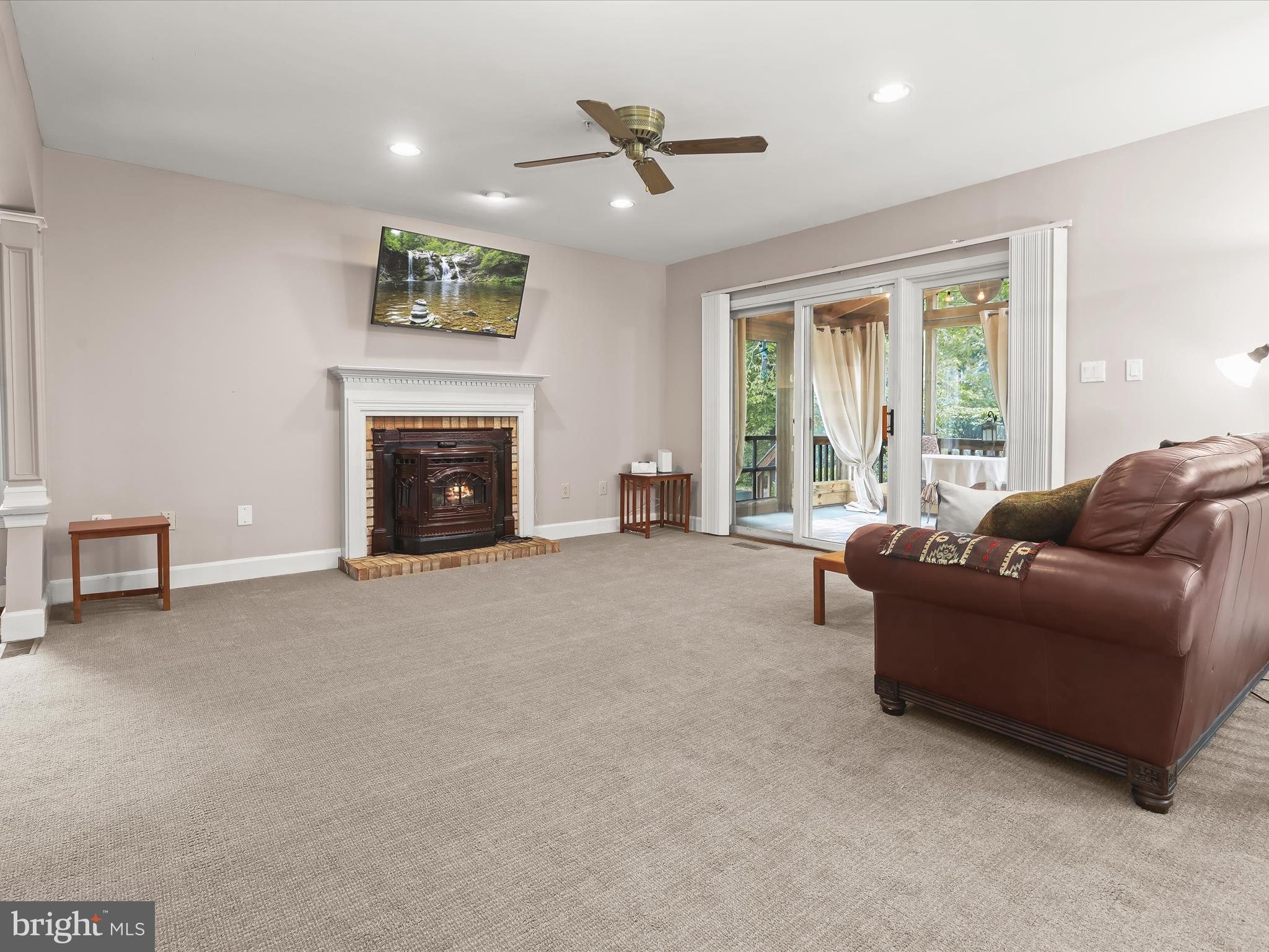 7501 Hillmeade Road Bowie, MD 20720 - Photo 3 of 55 Family room w/ stove and porch access