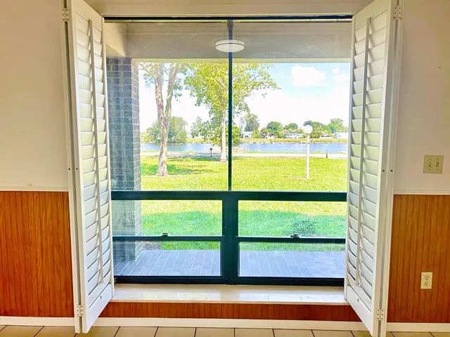 a kitchen with stainless steel appliances a refrigerator sink and microwave