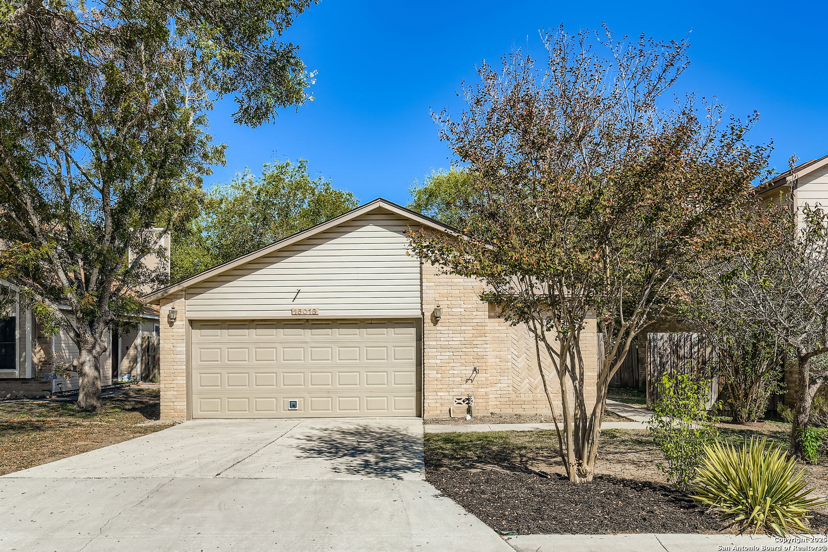 15018 Spring Shower San Antonio, TX 78247 - Photo 1 of 29 a front view of a house with a yard