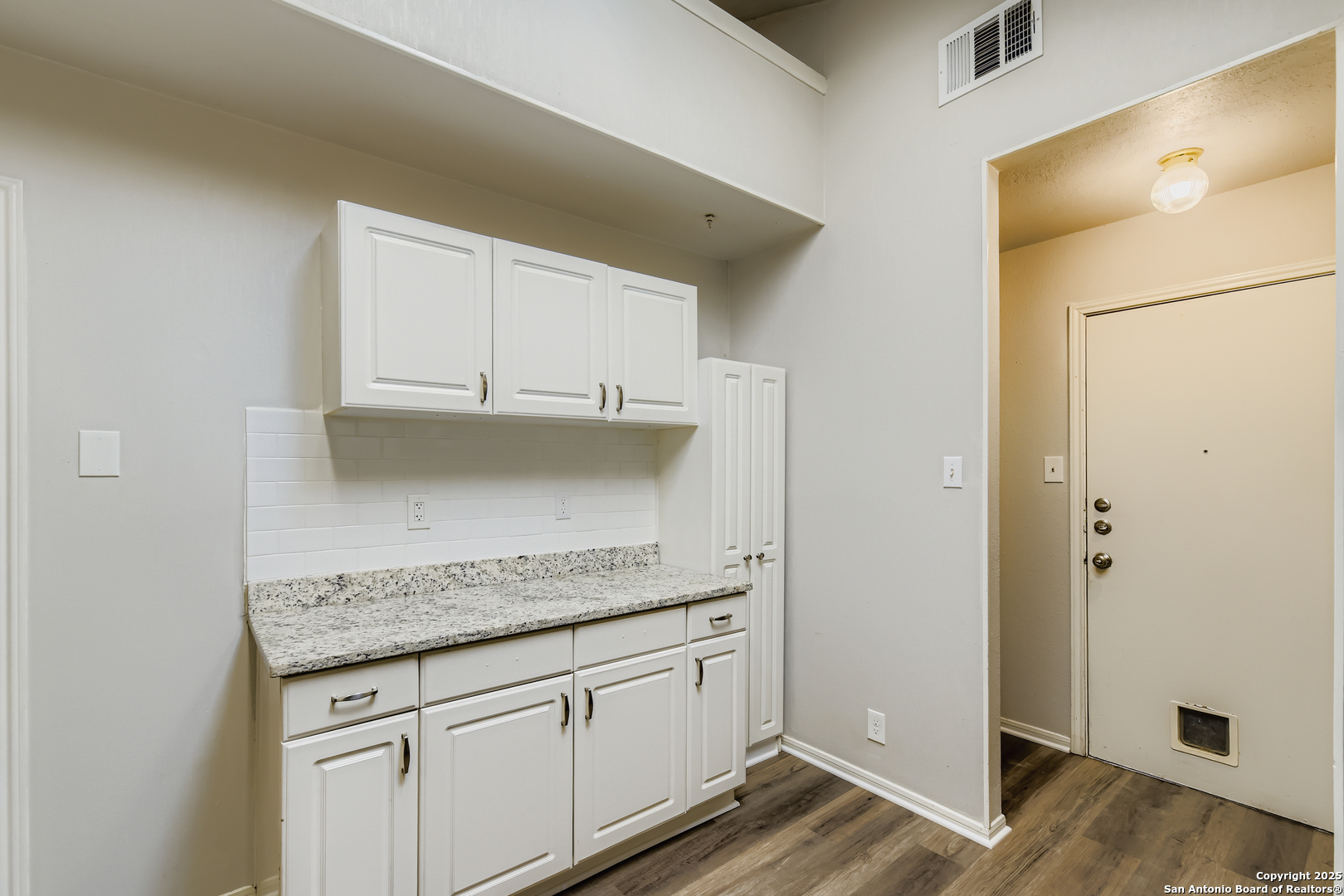 15018 Spring Shower San Antonio, TX 78247 - Photo 12 of 29 a kitchen with granite countertop cabinets and white appliances