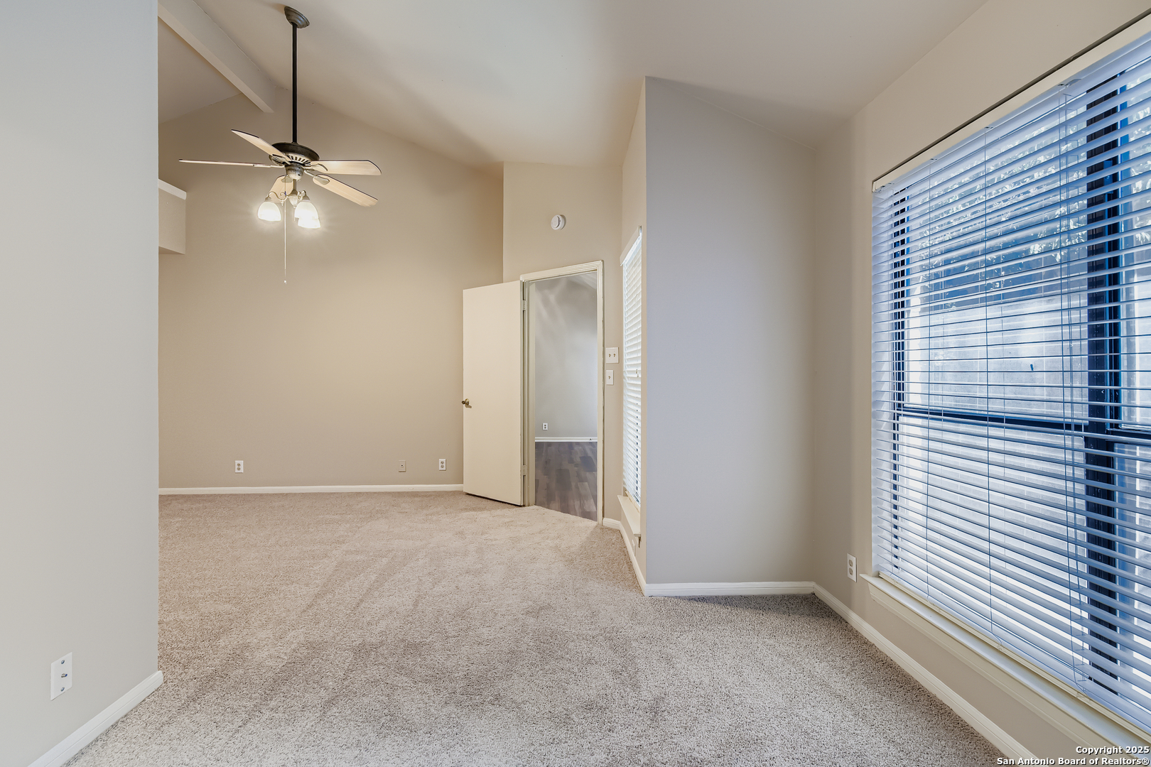 15018 Spring Shower San Antonio, TX 78247 - Photo 15 of 29 an empty room with windows and fan