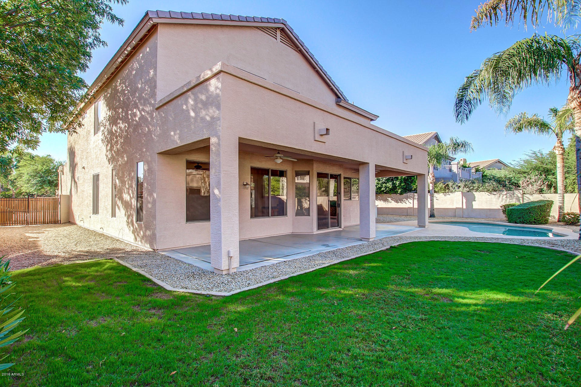 1360 East Harrison Street Gilbert, AZ 85295 - Photo 31 of 34 a front view of a house with a yard