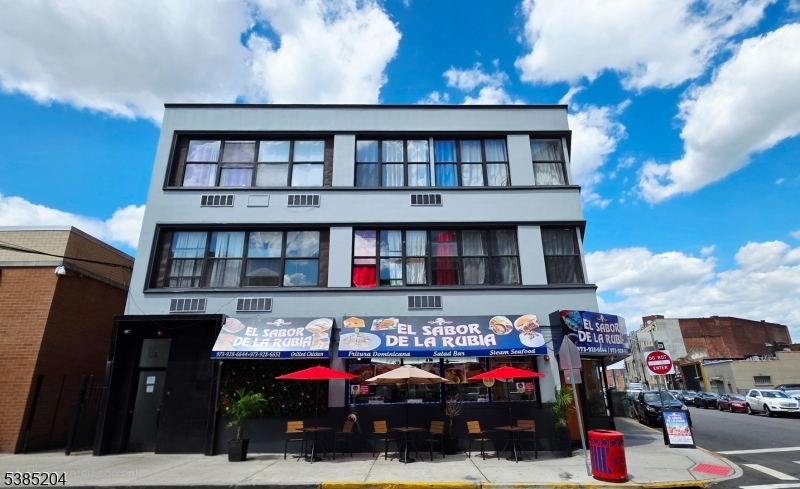a front view of building with cars