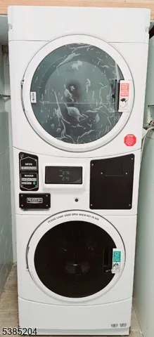 a utility room with a sink and toilet