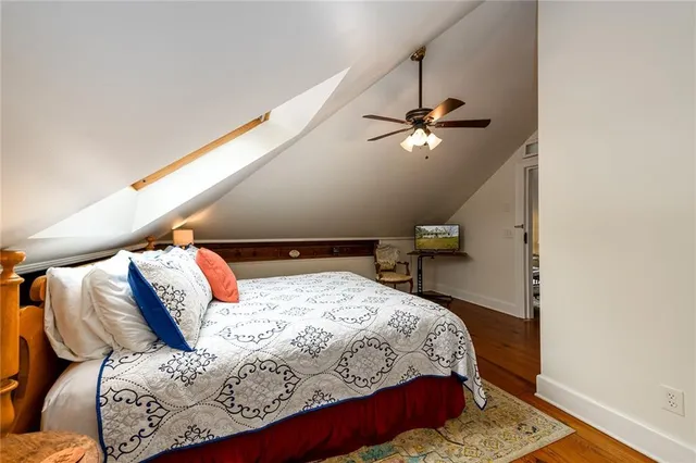an aerial view of a house with a yard basket ball court and outdoor seating