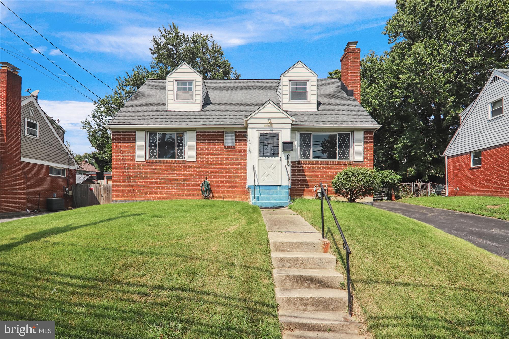 9507 Adelphi Road Silver Spring, MD 20903 - Photo 1 of 41 a front view of a house with a yard
