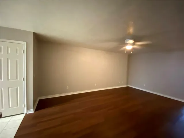 a view of a livingroom with wooden floor