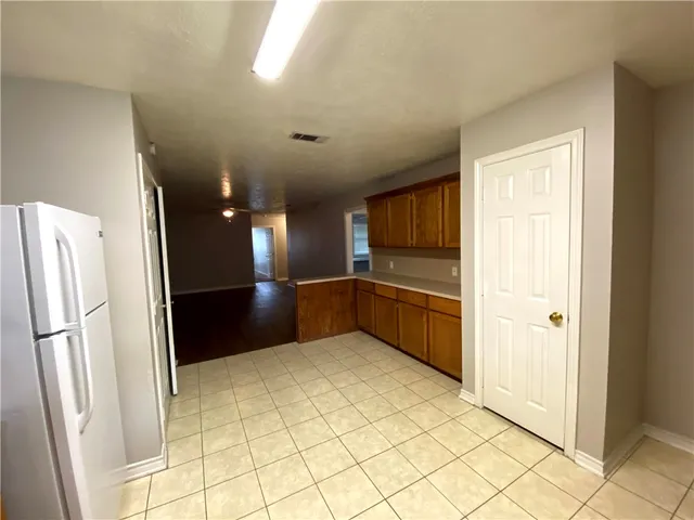a kitchen with stainless steel appliances a refrigerator and a sink
