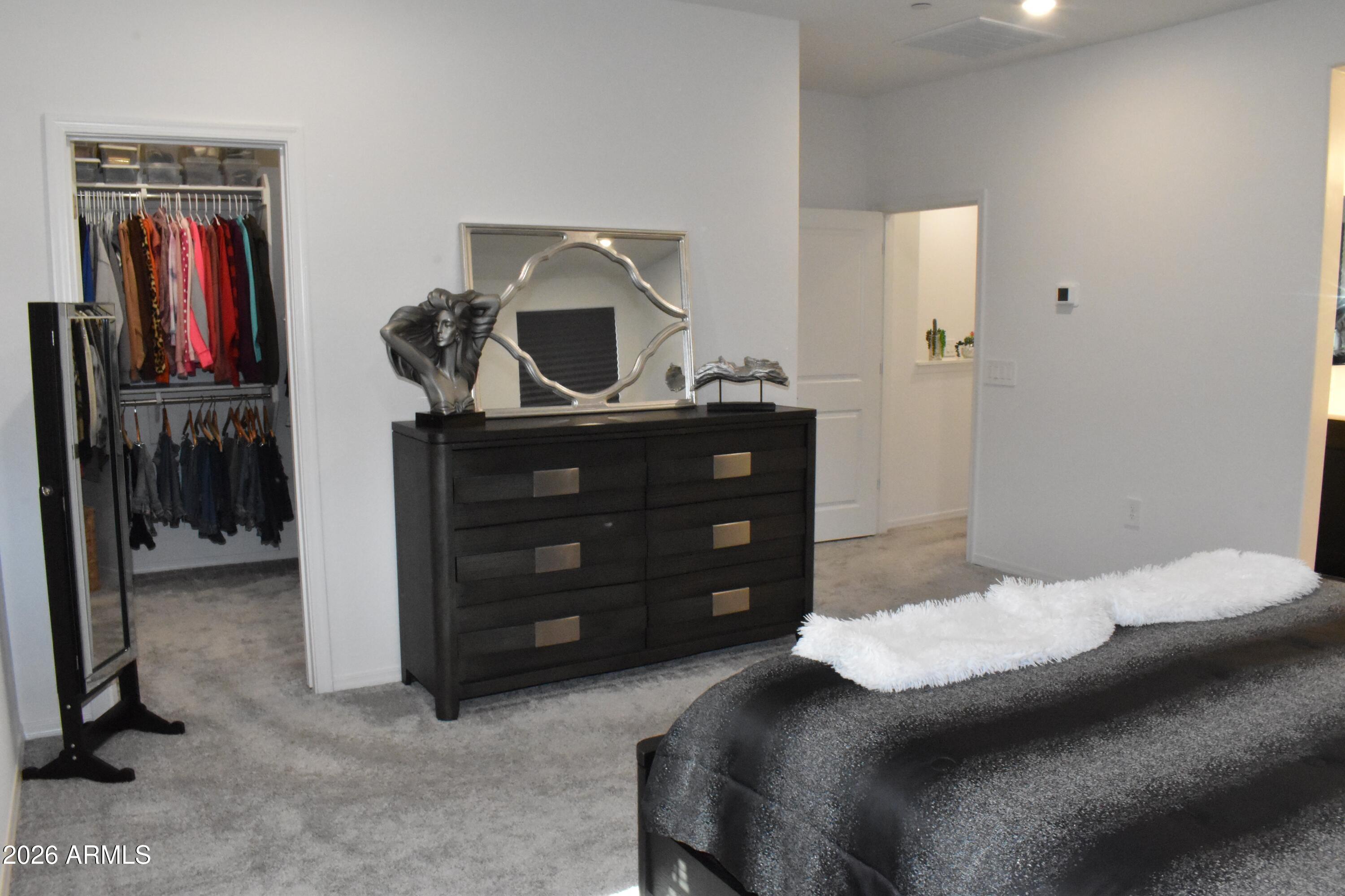 1821 East Bernie Lane, Unit 107 Gilbert, AZ 85295 - Photo 16 of 39 a bedroom with a bed and a closet