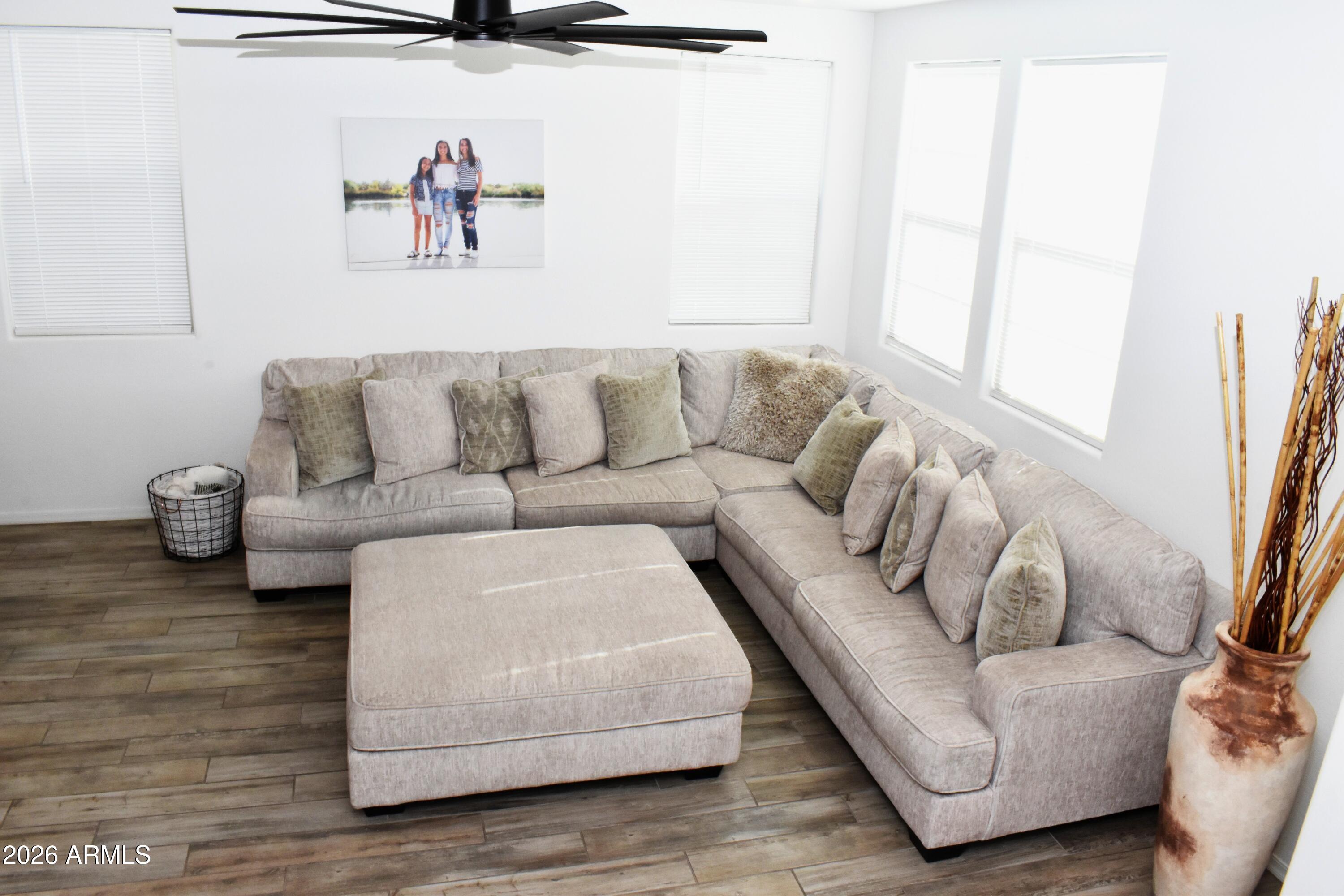 1821 East Bernie Lane, Unit 107 Gilbert, AZ 85295 - Photo 9 of 39 a living room with furniture and a couch