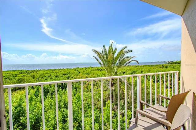 a view of a balcony with wooden floor