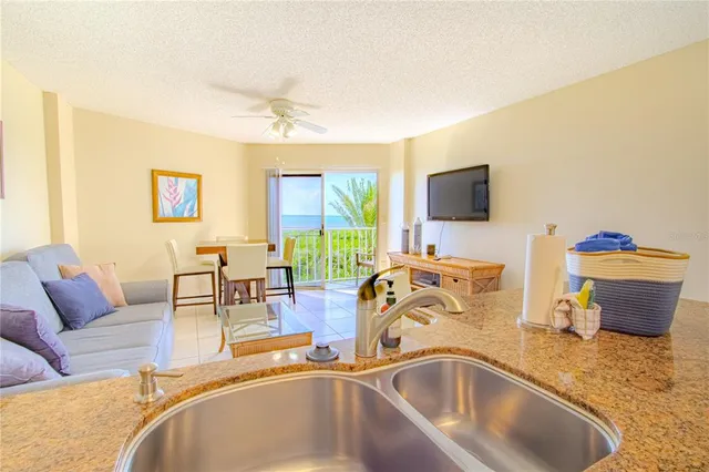 a view of a livingroom with workspace and a couch