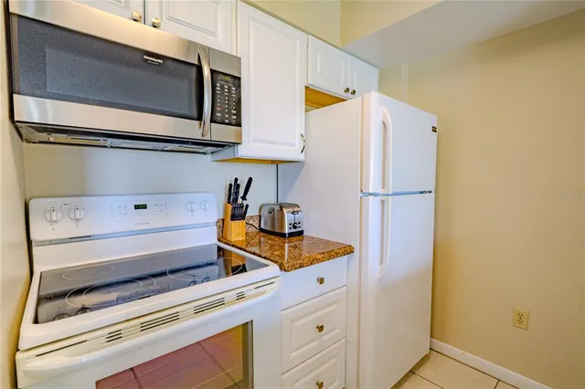 a view of storage and utility room with washer and dryer