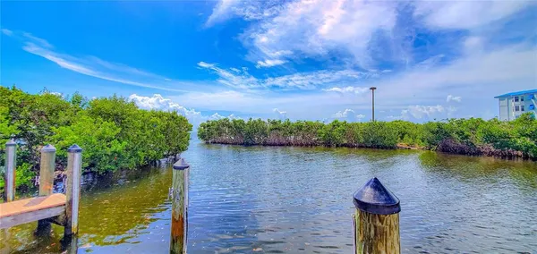 a view of a lake with a house in the background