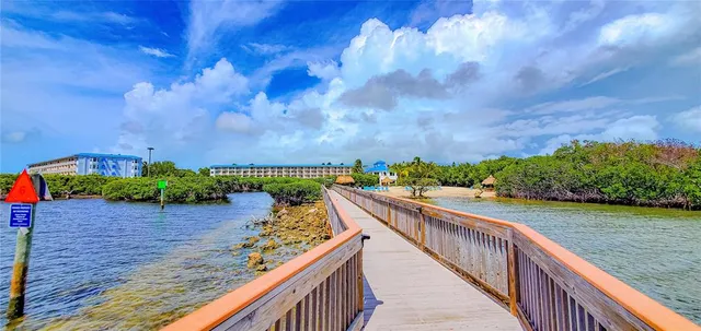 a view of a balcony with wooden floor