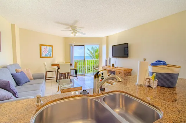 a view of a livingroom with workspace and a couch