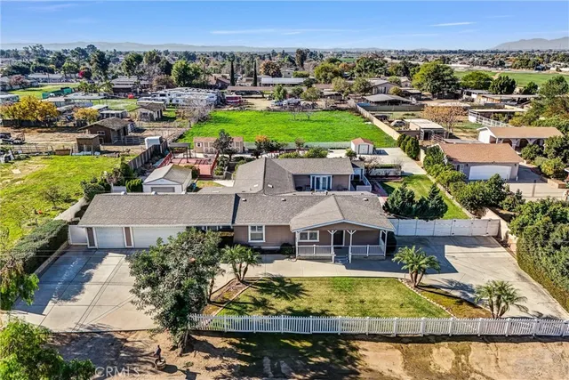 an aerial view of a house with a garden